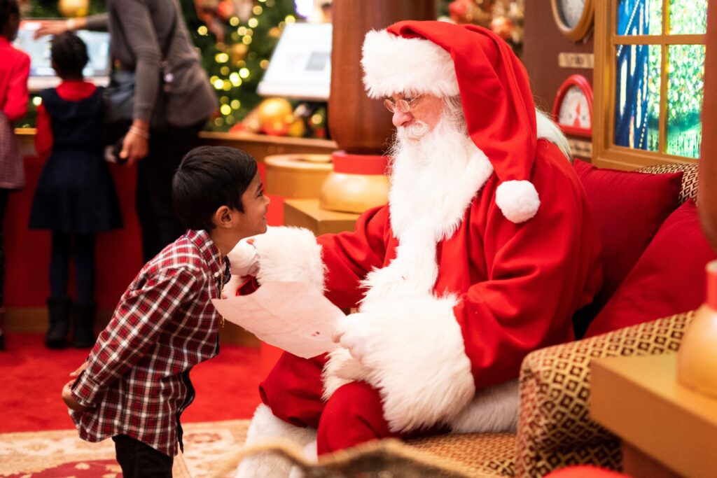 Santa was reading a letter from a kid.